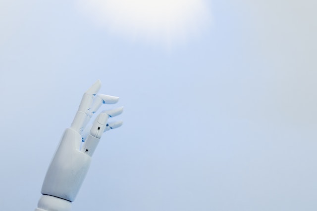 A robot's hand reaching upward.