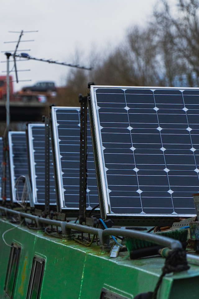 A series of solar panels set up atop a roof