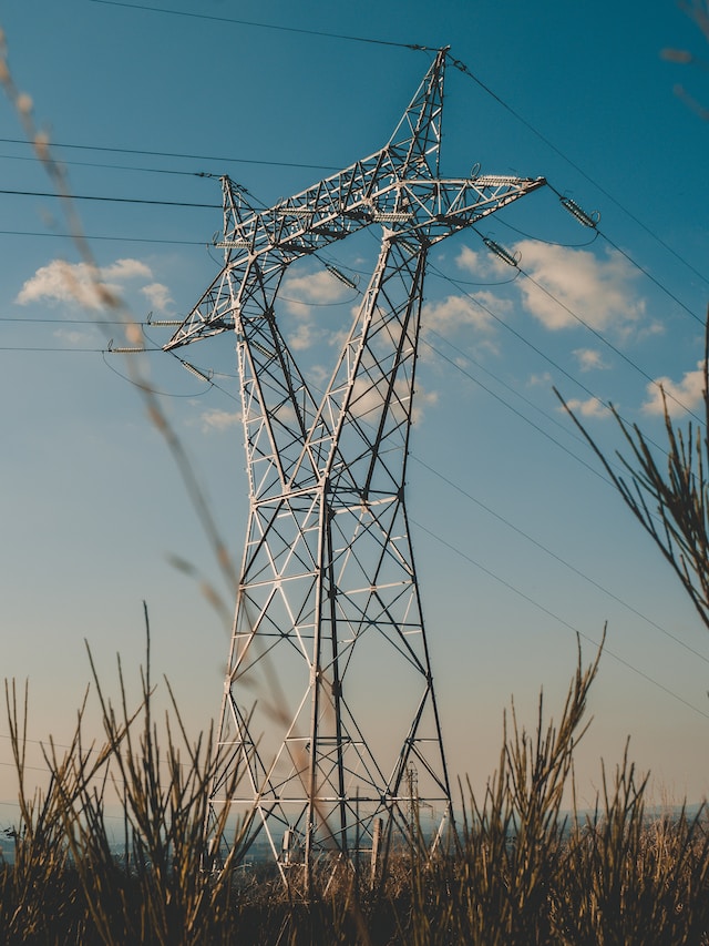 An electric transmission tower attached to electric transmission cables