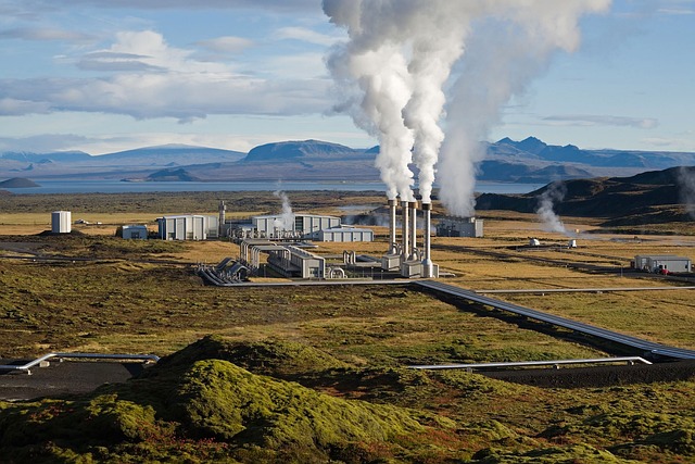 A geothermal power plant situated in a vast open field