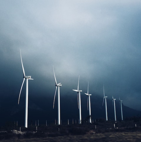 Wind mills against a cloudy, overcast sky